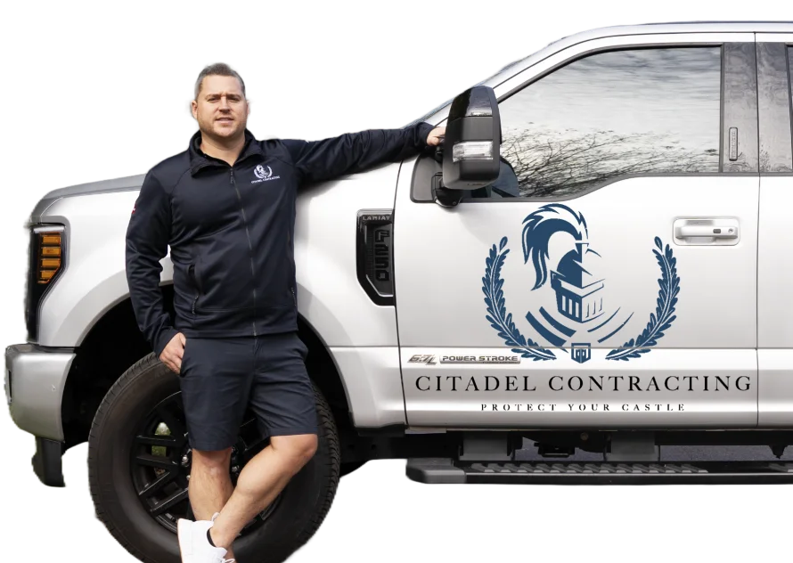 Nick Capps standing beside a Citadel Contracting truck